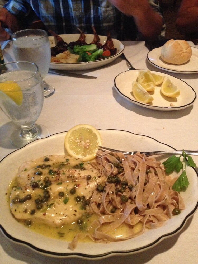 Chicken piccata and whole wheat pasta. Delicious. Lamb chops in the background